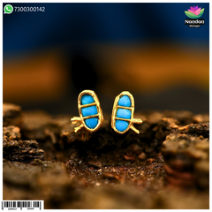 Nandan Shringar Makrakrit jadaau kundal in firoja color with intricate design and kundan embellishments.
