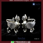 Fine silver Kaamdhenu cow figurines, beautifully crafted, showcasing intricate details from Utsav Arts.