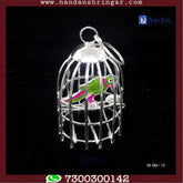 Fine silver parrot sculpture by Utsav Arts, showcasing intricate detailing and craftsmanship.