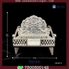 Fine silver Sinhasan by Utsav Arts, featuring intricate designs and traditional craftsmanship, displayed on a soft background.