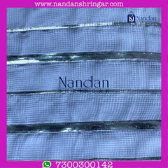White Dhora Wala Doriya Special Zari Vastra showcasing intricate zari work from Nandanshringars.