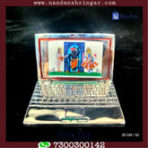 Fine silver laptop by Utsav Arts showcasing a sleek design and elegant finish.