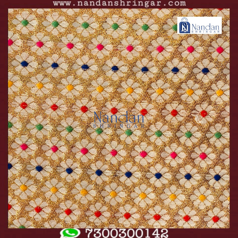 Yellow designer Zari Vastra by Nandanshringars, showcasing intricate patterns and rich texture in elegant fabric.
