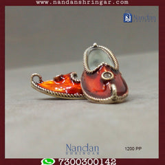 Fine silver Mojadi from Utsav Arts showcasing intricate design and craftsmanship in a traditional style.
