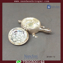 Fine silver tortoise sculpture by Utsav Arts, showcasing intricate detailing and craftsmanship.