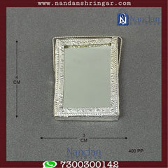 Small 4 cm fine silver mirror from Utsav Arts, featuring intricate traditional design, suitable for decorative or personal use.