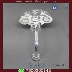 Fine silver Aarti by Utsav Arts, showcasing intricate detailing and traditional design in a beautifully crafted piece.