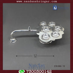 Fine silver Aarti by Utsav Arts, showcasing intricate design details and elegant craftsmanship.