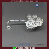 Fine silver Aarti by Utsav Arts, featuring intricate design and craftsmanship, displayed in elegant lighting.
