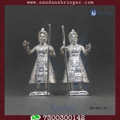 Pair of Dwarpal Fine Silver decorative figures by Utsav Arts, showcasing intricate detailing and craftsmanship.