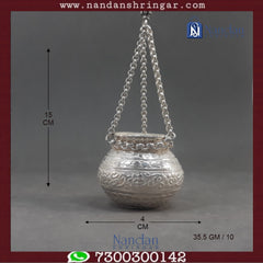 Fine silver hanging handi by Utsav Arts, showcasing intricate design and craftsmanship in a decorative style.