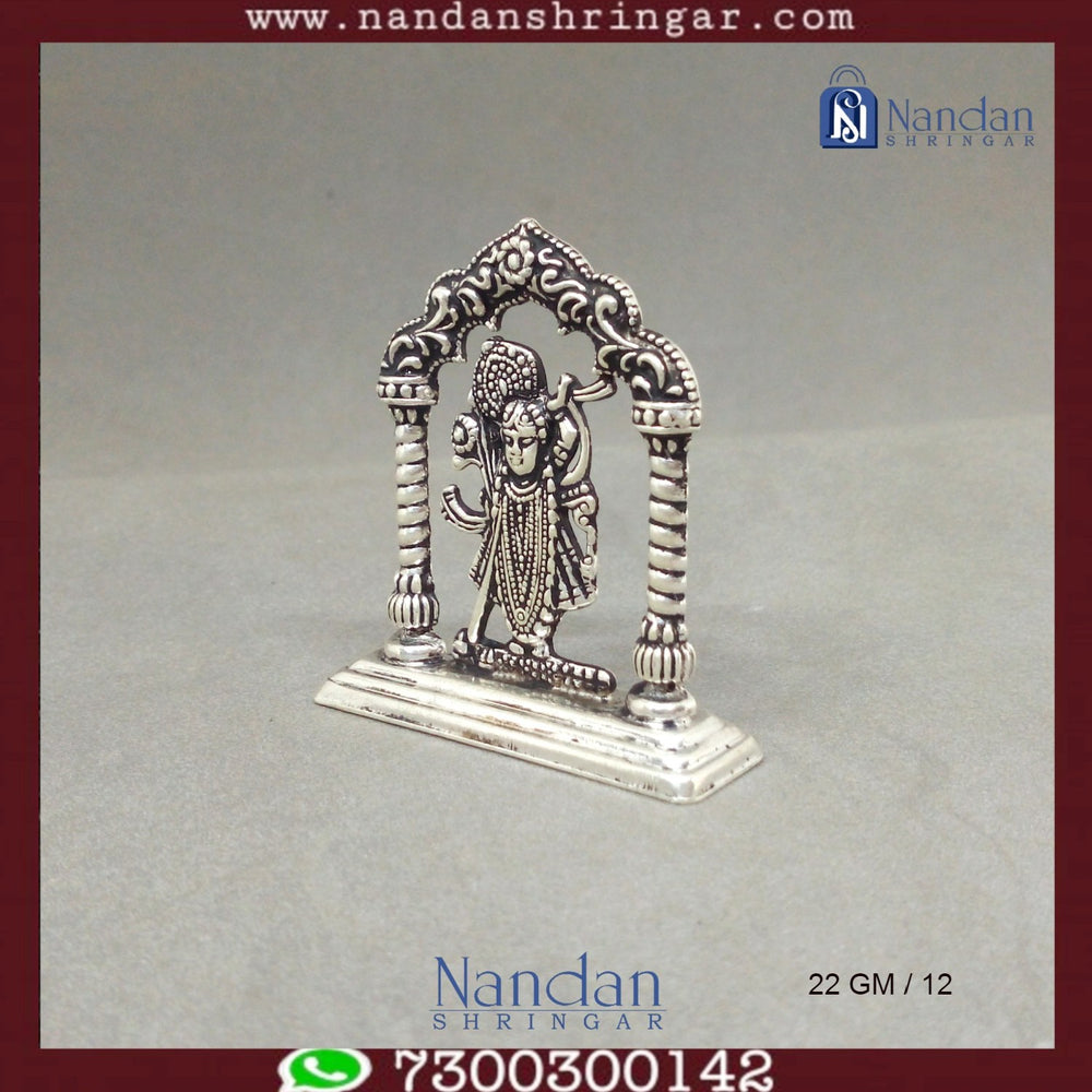 Fine silver Shreenath Ji idol with Rajbhog attire from Utsav Arts, showcasing intricate details and craftsmanship.