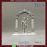 Fine silver Shreenath Ji figurine from Utsav Arts, showcasing intricate details and vibrant colors in a traditional design.