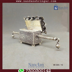 Fine silver Mayur Doli Box by Utsav Arts, showcasing intricate designs and elegant craftsmanship.