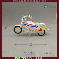Fine silver motorcycle sculpture by Utsav Arts, showcasing intricate details and craftsmanship in a stunning design.