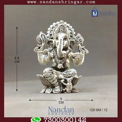 Fine silver Shree Ganesh idol by Utsav Arts, showcasing intricate details and craftsmanship in a serene pose.
