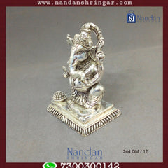 Fine silver Shree Ganesh sculpture by Utsav Arts, intricately designed with detailed craftsmanship and a polished finish.