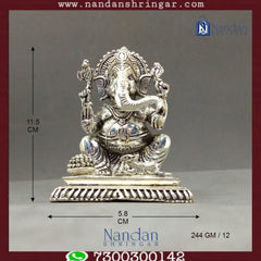 Fine silver Shree Ganesh idol by Utsav Arts, showcasing intricate detailing and craftsmanship in a serene pose.