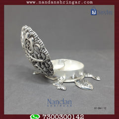 Fine silver tortoise figurine by Utsav Arts, detailed craftsmanship, showcasing a smooth silver surface and intricate design.
