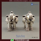 Antique silver elephant figurines by Utsav Arts, showcasing intricate craftsmanship and fine detailing.