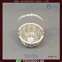 Fine silver basket by Utsav Arts, featuring intricate designs and a polished finish, displayed against a neutral background.