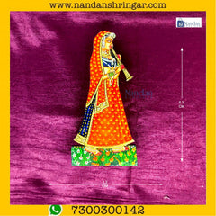 Orange Gopi Shahnaai Pair by NandanShringars, featuring intricate designs and traditional craftsmanship.