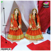 Pair of 10-inch cloth Gopi sets by Nandanshringars, featuring traditional Indian fabric and intricate design details.