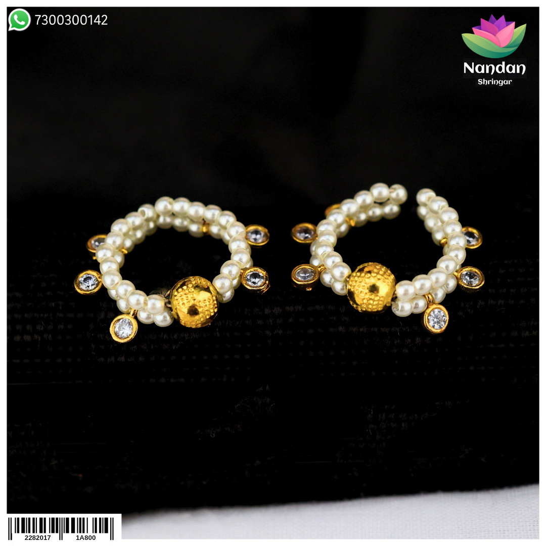 Nandanshringars Nupur Soneri Moti traditional silver toe ring with intricate design, displayed on a neutral background.
