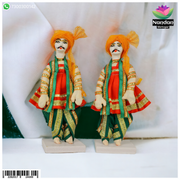 Pair of 6-inch cloth gop sets by nandanshringars, showing detailed traditional Indian attire on a display.