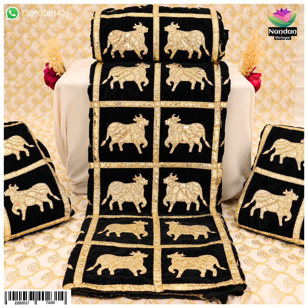 Black cow print velvet vastra with box pattern from Nandan Shringar, featuring soft velvet fabric and bold cow print design.