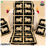 Black cow print velvet vastra with box pattern from Nandan Shringar, featuring soft velvet fabric and bold cow print design.