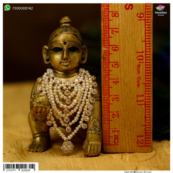 Heera Haar by nandanshringars featuring lustrous real pearls elegantly strung together in a classic design.