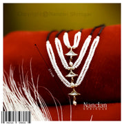 Nandan Shringar Jadaau single lad mala with Heera, traditional Indian jewelry featuring intricate gold design and a central gemstone.
