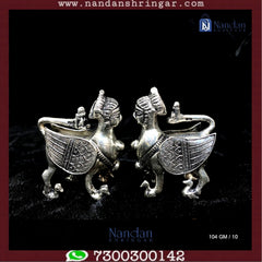 Fine silver Kaamdhenu cow figurines, beautifully crafted, showcasing intricate details from Utsav Arts.