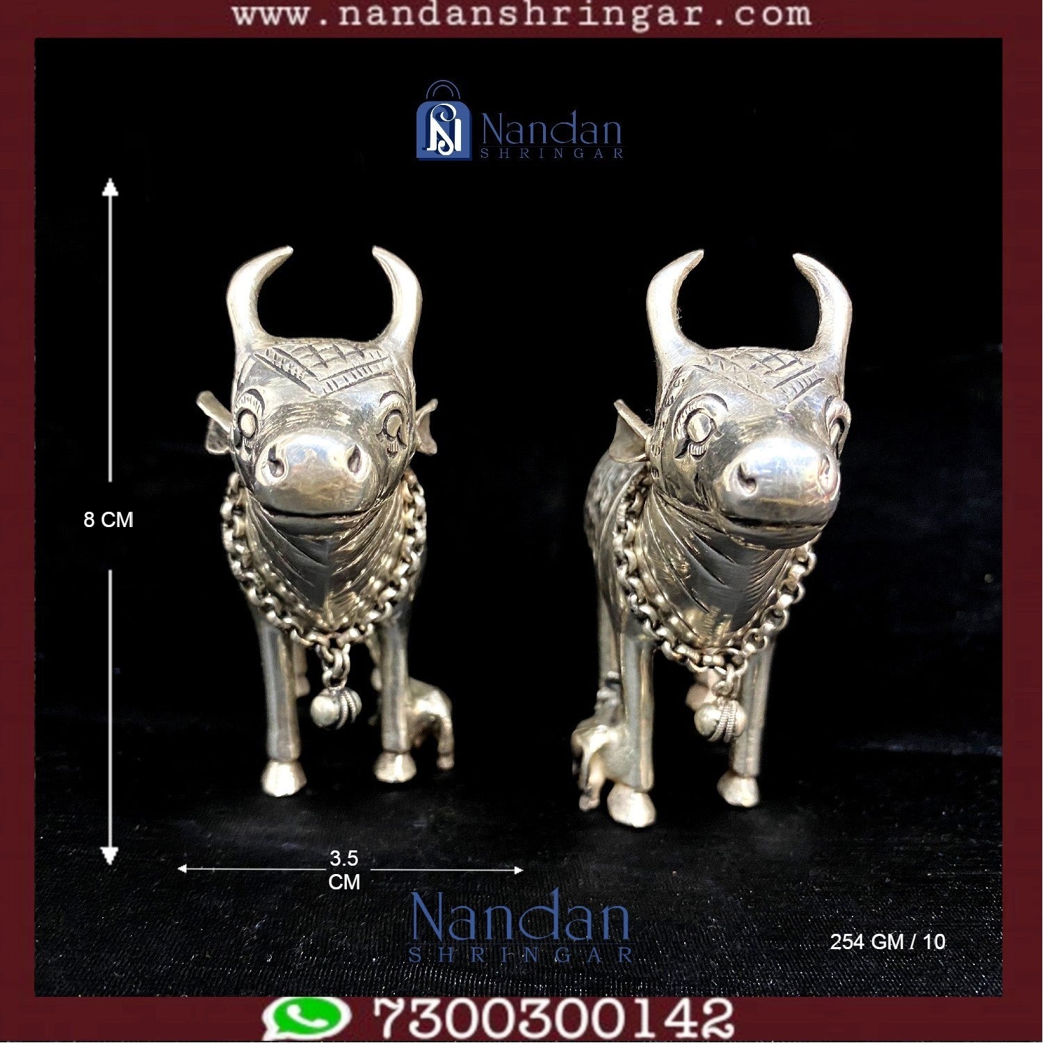 Fine silver cow figurine pair by Utsav Arts, showcasing intricate detailing and craftsmanship against a neutral background.
