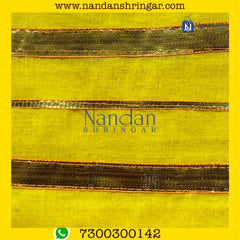 Yellow Dhora Wala Special Zari Vastra by Nandanshringars, showcasing intricate zari work and vibrant color.