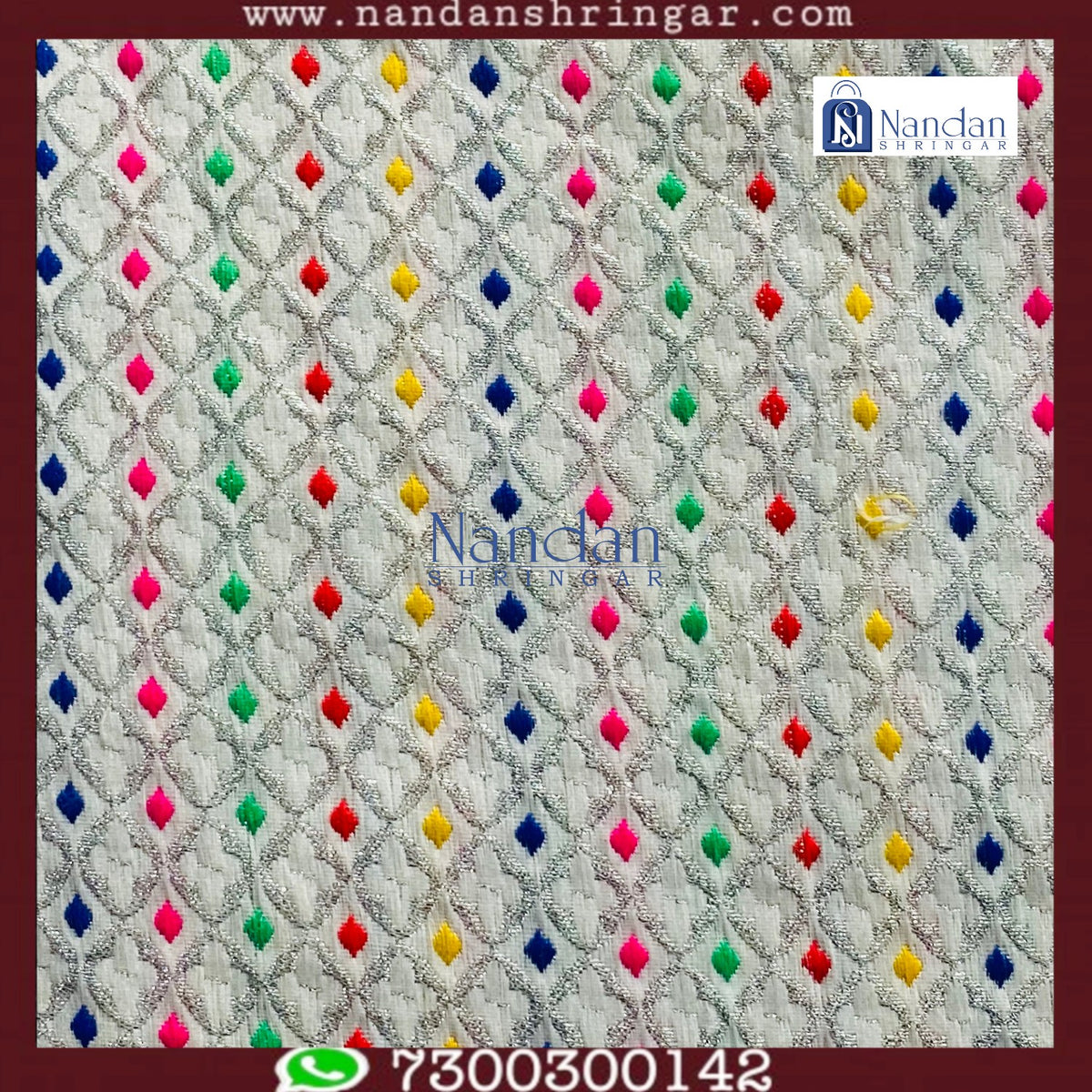 White designer zari vastra by nandanshringars, showcasing intricate embroidery and elegant fabric draping.