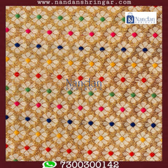 Yellow designer Zari Vastra by Nandanshringars, showcasing intricate patterns and rich texture in elegant fabric.