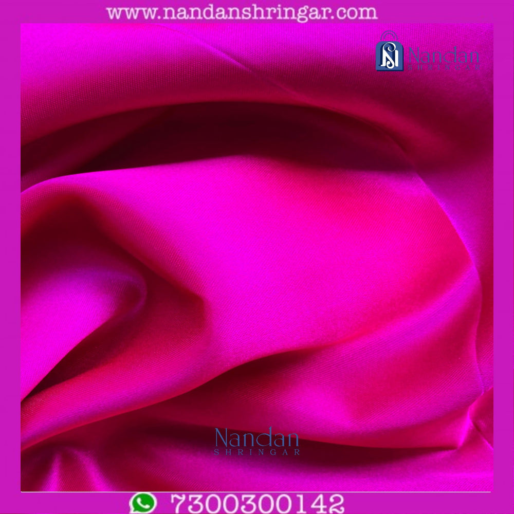 Pink satin Vastra from Nandanshringars, elegant traditional fabric featuring a smooth, shiny pink satin material with intricate details.
