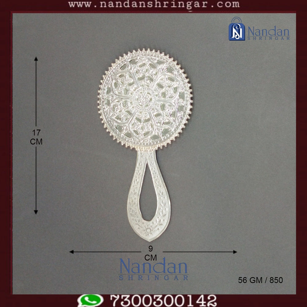 Fine silver Aarsi mirror by Utsav Arts, featuring intricate detailing and a reflective surface, set against a neutral background.