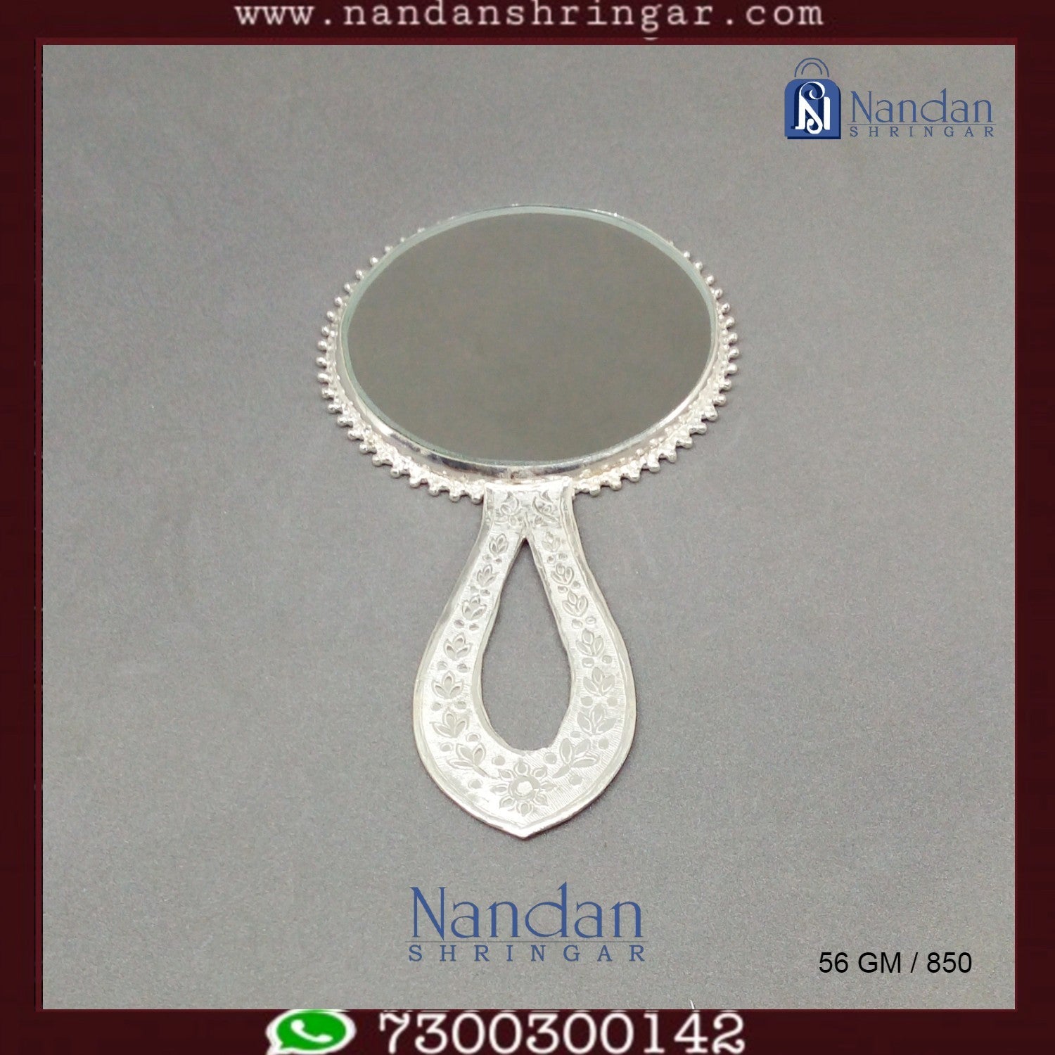 Fine silver Aarsi mirror by Utsav Arts, featuring intricate detailing and a reflective glass surface.