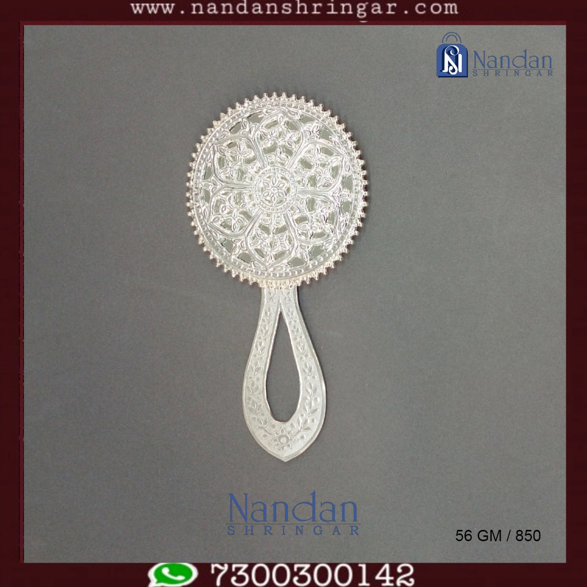 Fine silver Aarsi mirror by Utsav Arts, featuring intricate detailing and a reflective surface, elegantly displayed.