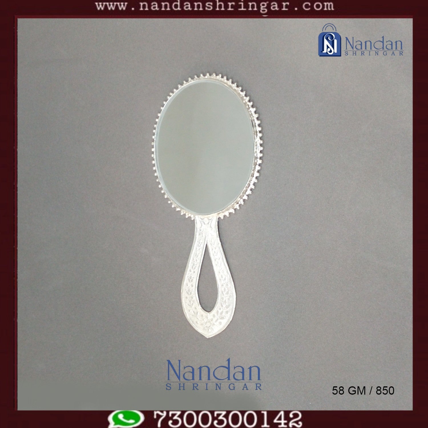 Fine silver Aarsi mirror from Utsav Arts showcasing intricate designs and a reflective surface.