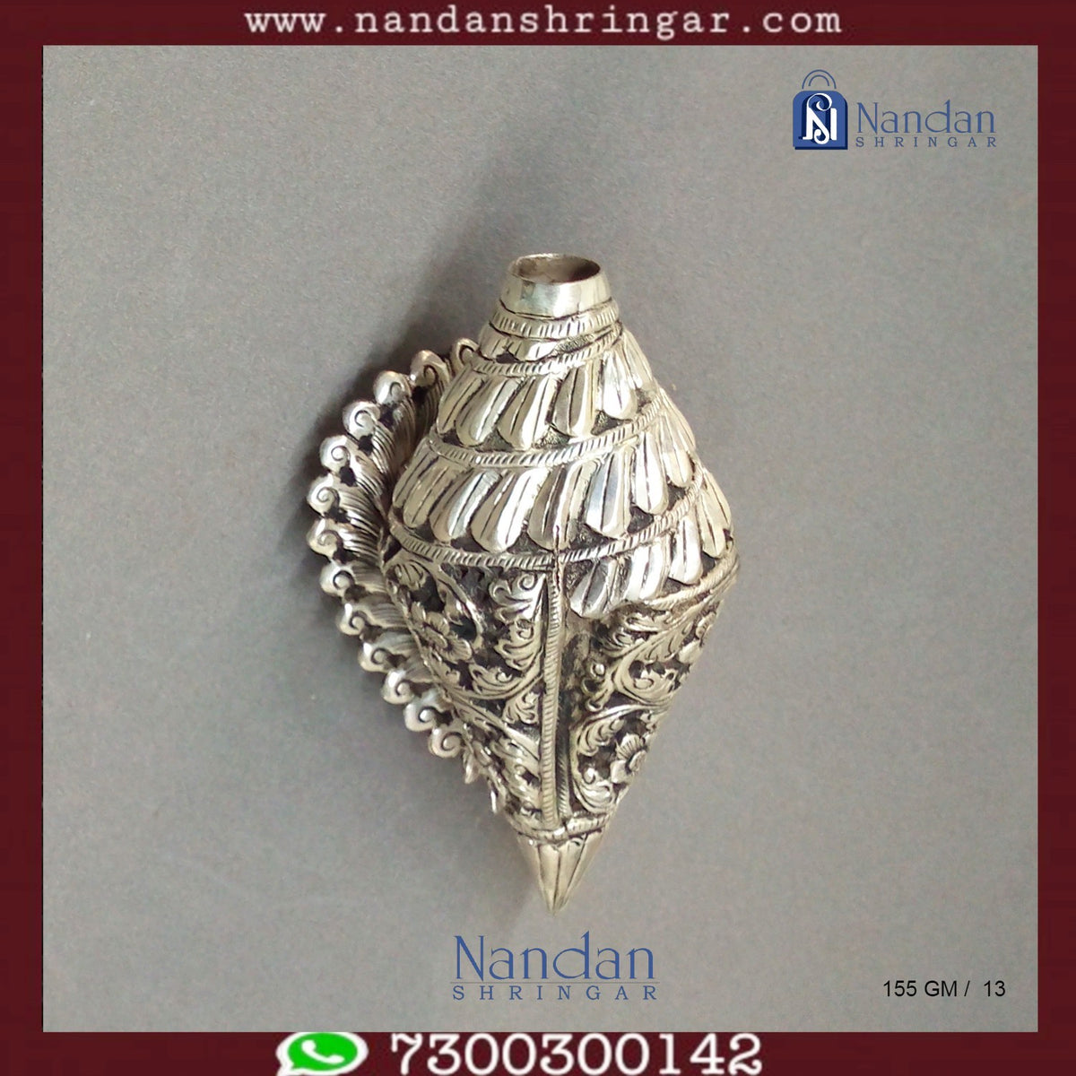 Fine silver carving shankh by Utsav Arts, showcasing intricate designs and a polished finish.