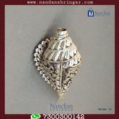 Fine silver carving shankh by Utsav Arts, showcasing intricate designs and a polished finish.