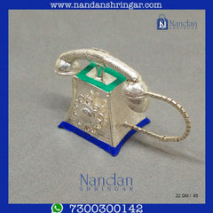 Fine silver telephone by Utsav Arts with intricate detailing and elegant design, showcasing craftsmanship.
