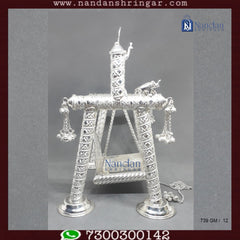Premium fine silver carving palna by Utsav Arts, showcasing intricate designs and craftsmanship in a traditional style.