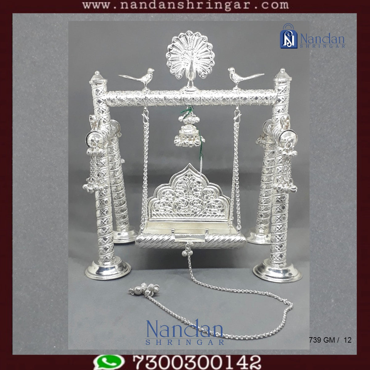 Premium fine silver carving palna by Utsav Arts, showcasing intricate designs and craftsmanship in a beautiful display.