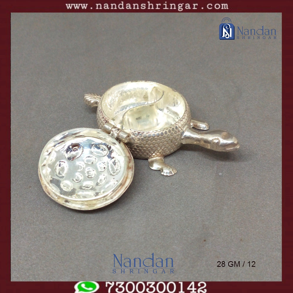 Fine silver tortoise sculpture by Utsav Arts, showcasing intricate detailing and craftsmanship.