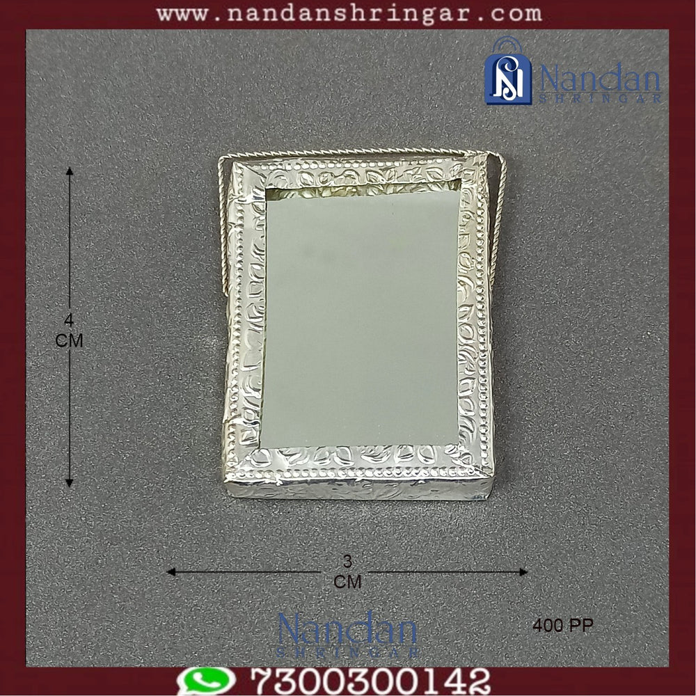Small 4 cm fine silver mirror from Utsav Arts, featuring intricate traditional design, suitable for decorative or personal use.